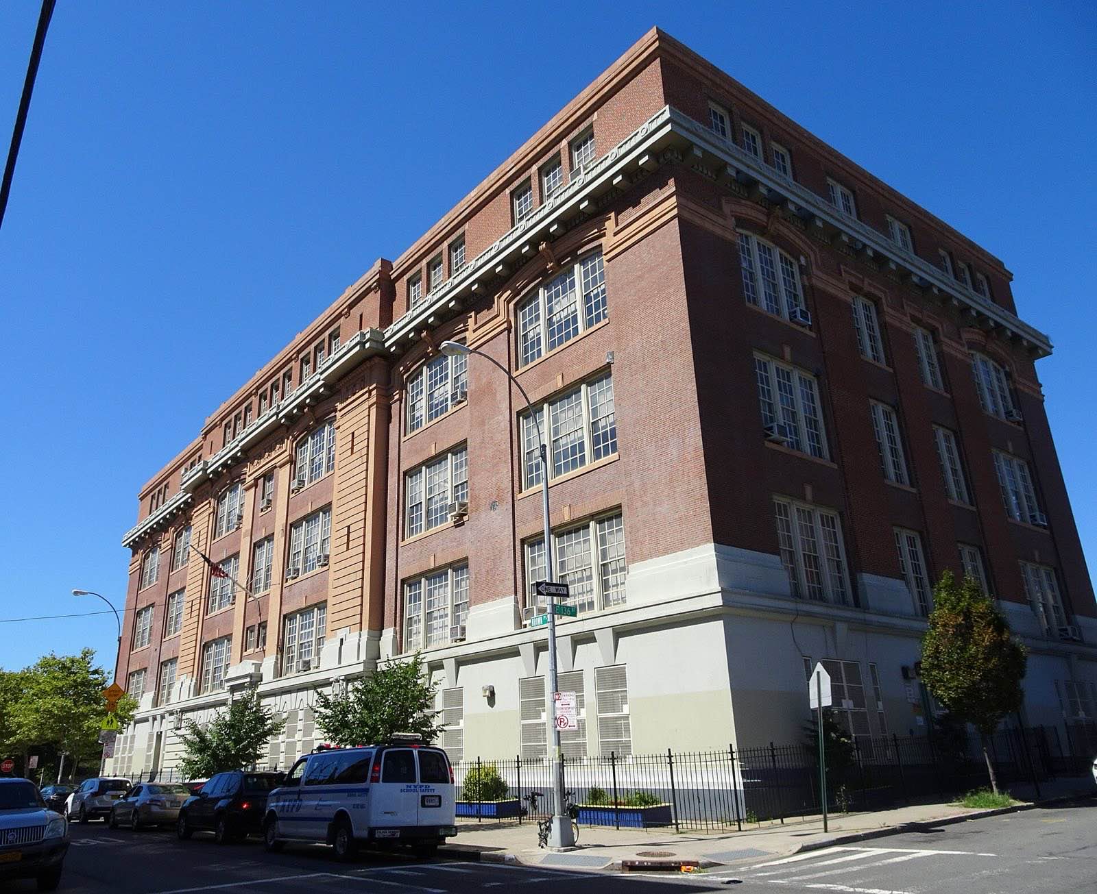 Looking west across 136th St and Brown Place at PS 43 Jonas Bronck School on a sunny late morning